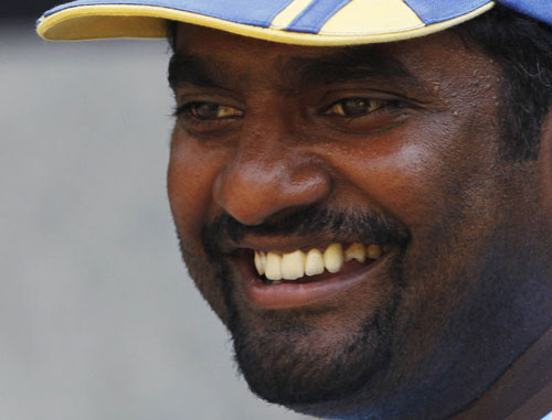 Sri Lanka's Muttiah Muralitharan smiles during a cricket practice session ahead of their ICC Cricket World Cup final match against India on Saturday in Mumbai, March 31, 2011. REUTERS/Danish Siddiqui (INDIA - Tags: SPORT CRICKET)